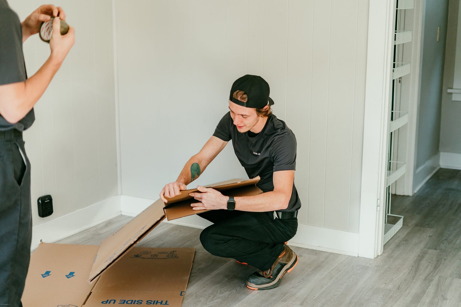 Full-service junk removal team hauling appliances in Central Oregon