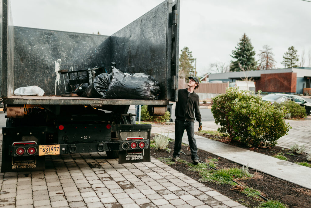 Junk removal crew clearing yard debris in La Pine, Oregon